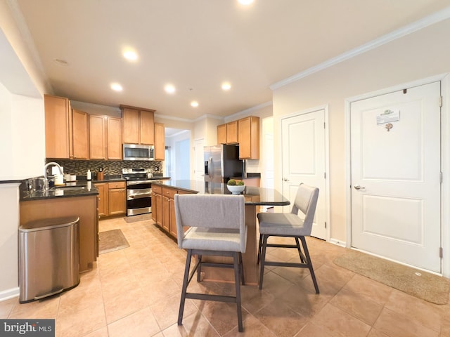 kitchen with a kitchen island, tasteful backsplash, sink, stainless steel appliances, and crown molding