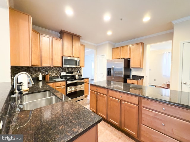 kitchen featuring sink, backsplash, ornamental molding, and appliances with stainless steel finishes