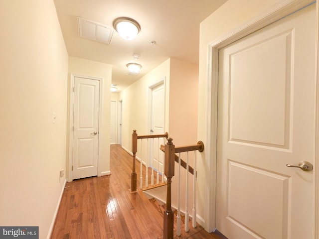 hallway with wood-type flooring