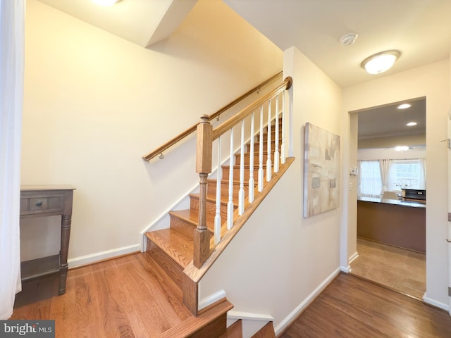 stairway featuring hardwood / wood-style flooring