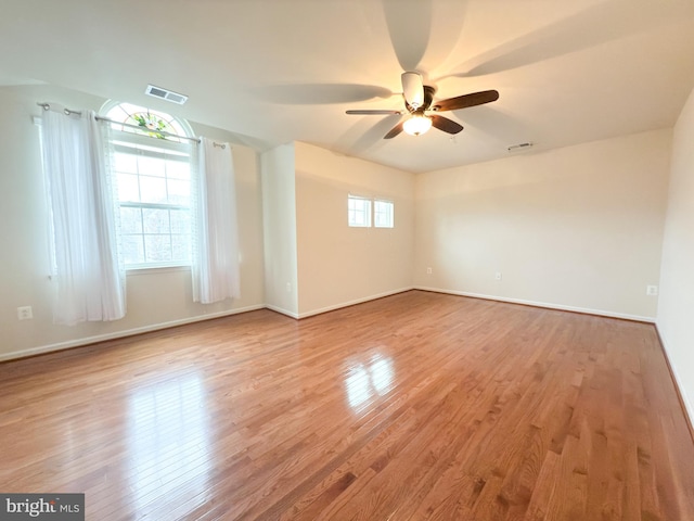 spare room featuring light hardwood / wood-style floors and ceiling fan