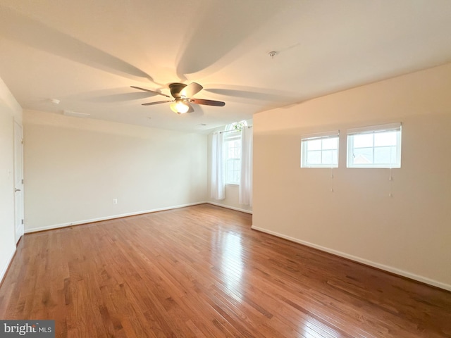 empty room featuring light hardwood / wood-style flooring and ceiling fan