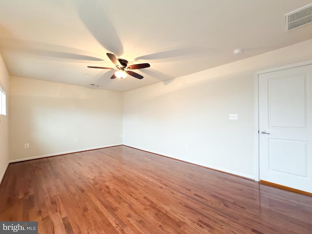 empty room featuring ceiling fan and wood-type flooring