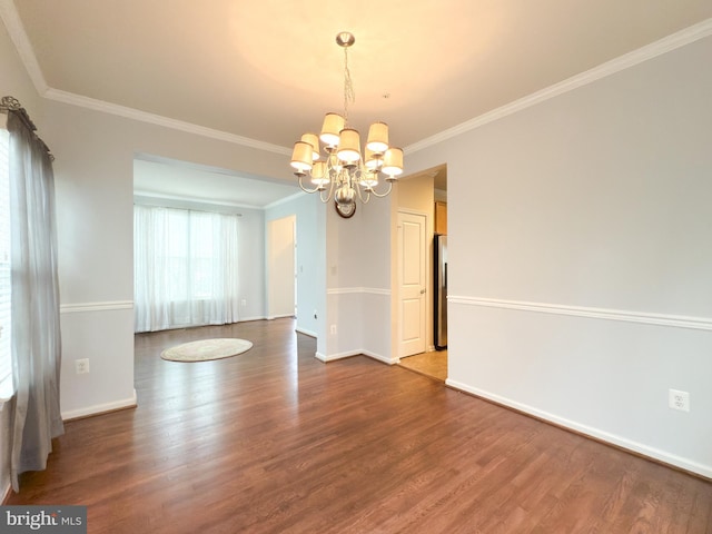 unfurnished dining area featuring ornamental molding, a notable chandelier, and dark hardwood / wood-style flooring