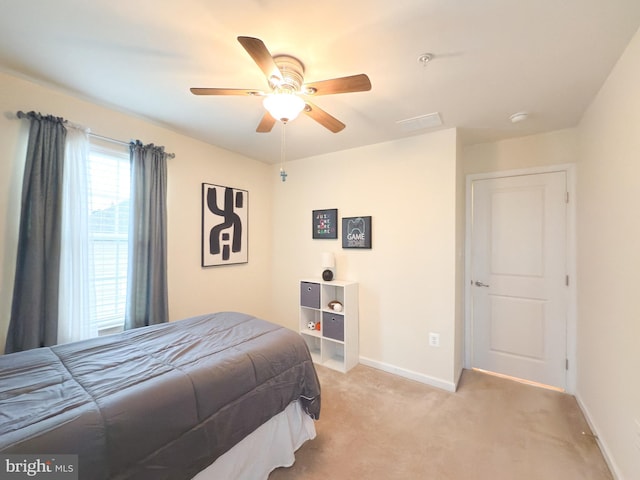 carpeted bedroom featuring ceiling fan