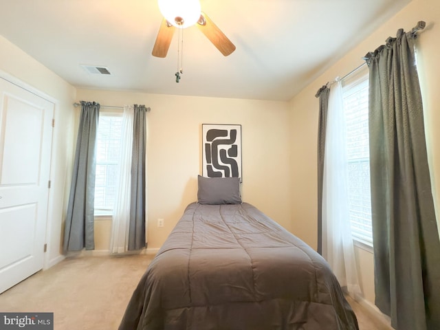 carpeted bedroom featuring ceiling fan