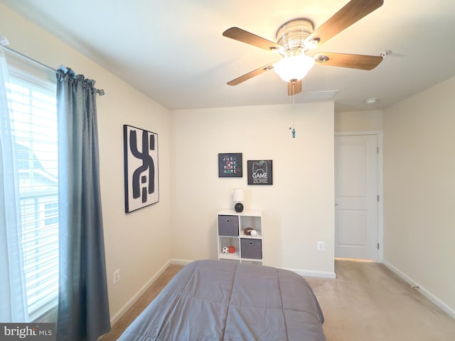 bedroom with light carpet and ceiling fan