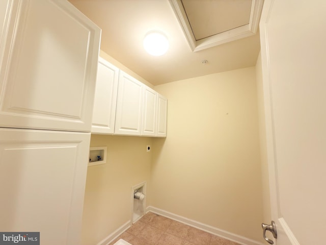 laundry room with electric dryer hookup, hookup for a washing machine, and cabinets