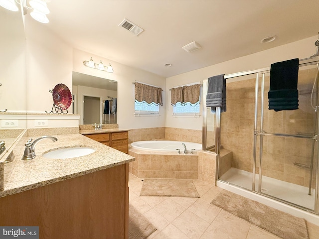 bathroom with vanity, separate shower and tub, and tile patterned floors