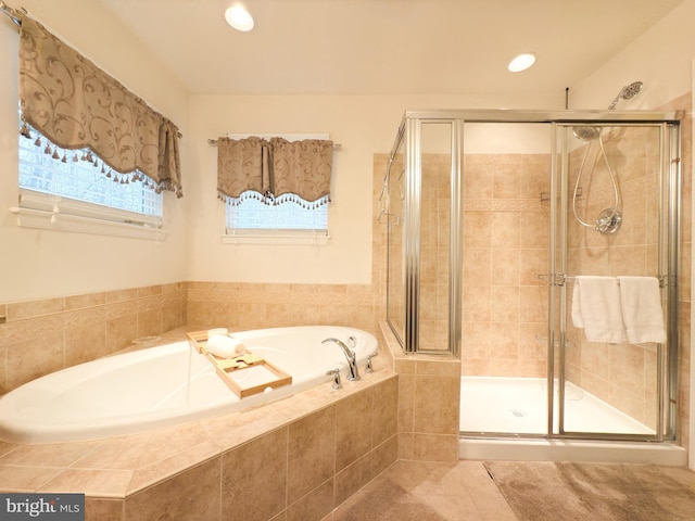 bathroom featuring tile patterned floors and plus walk in shower