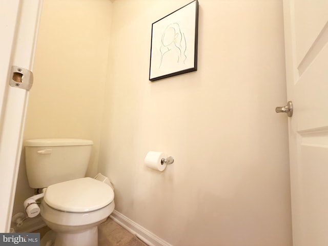 bathroom with tile patterned flooring and toilet