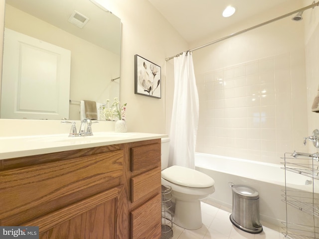 full bathroom with vanity, shower / tub combo with curtain, tile patterned floors, and toilet