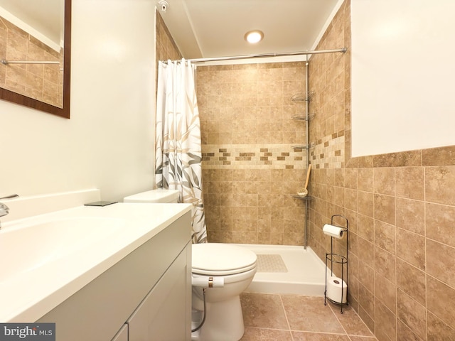 bathroom with vanity, toilet, tile patterned flooring, and a shower with shower curtain