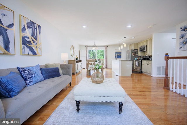 6406 Holyoke Dr, Annandale, VA 22003 - living room with recessed lighting, visible vents, and light wood-type flooring