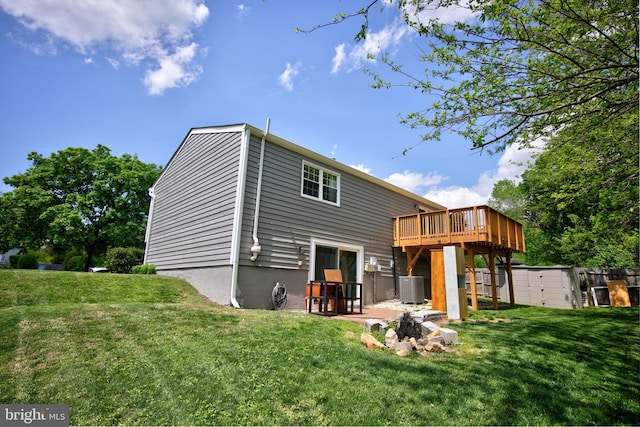 6406 Holyoke Dr, Annandale, VA 22003 - back of property featuring a storage shed, a deck, cooling unit, a lawn, and a patio