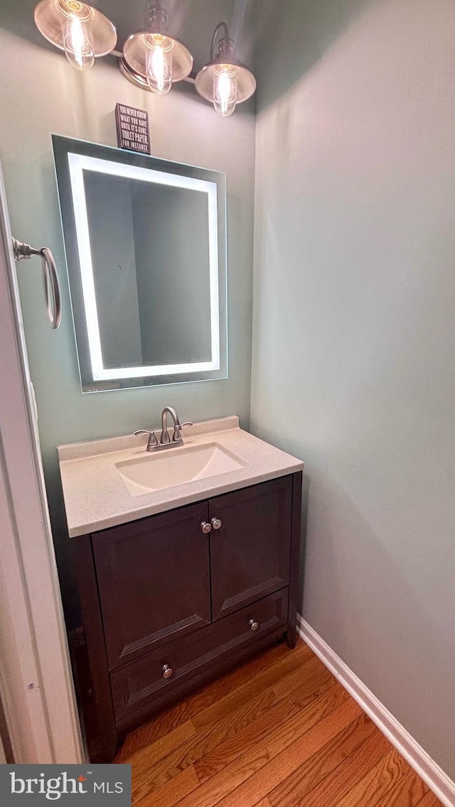 bathroom featuring vanity and hardwood / wood-style floors