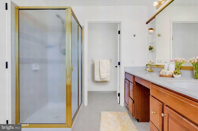 bathroom with vanity and a shower with shower door