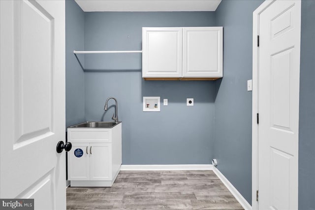 laundry area with sink, cabinets, hookup for a washing machine, electric dryer hookup, and light hardwood / wood-style floors