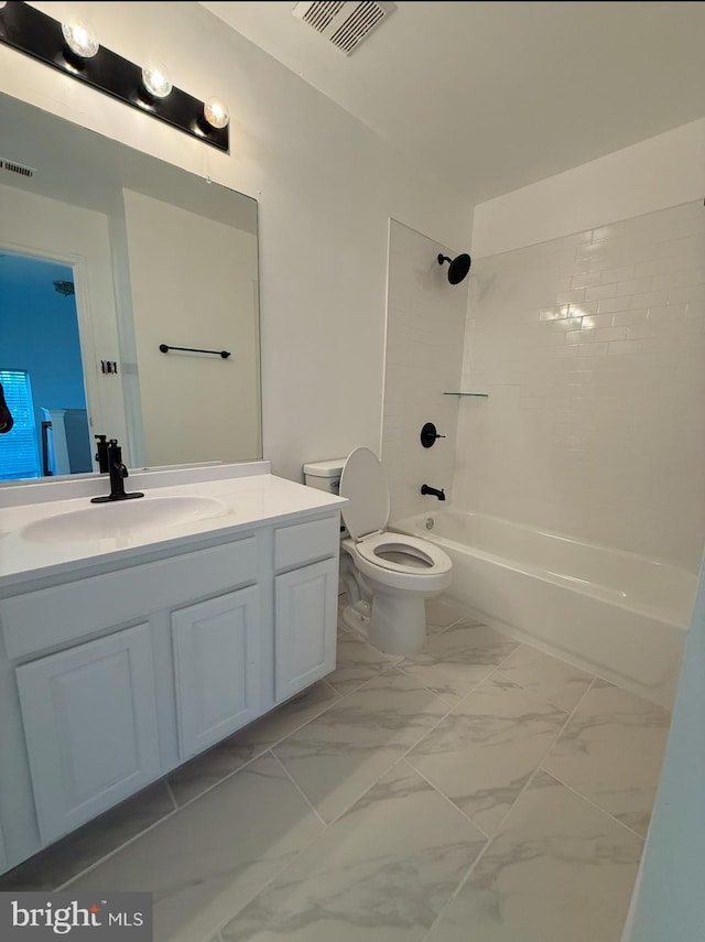 full bathroom with tiled shower / bath, vanity, and toilet