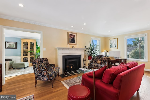 living room featuring ornamental molding and hardwood / wood-style floors