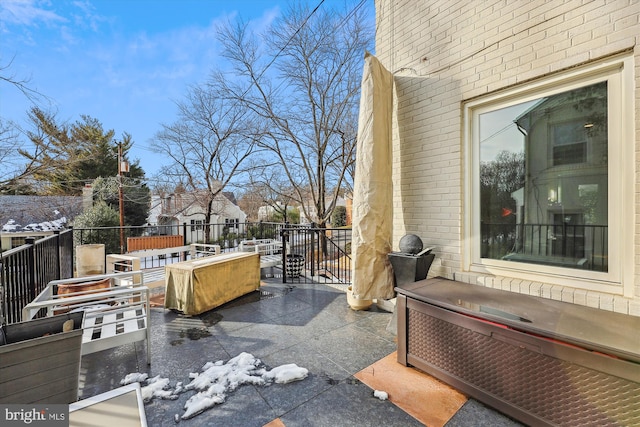 view of patio / terrace featuring a jacuzzi