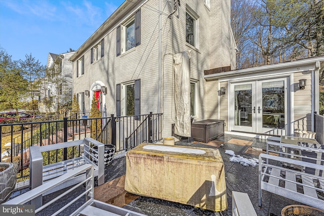 view of side of home featuring french doors