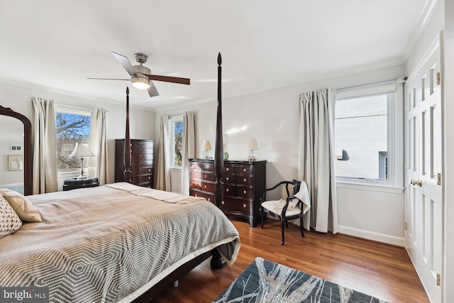 bedroom with crown molding, wood-type flooring, and ceiling fan