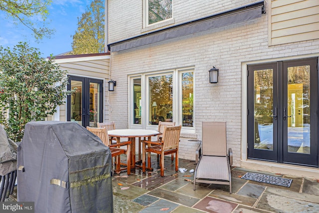 view of patio / terrace featuring grilling area and french doors