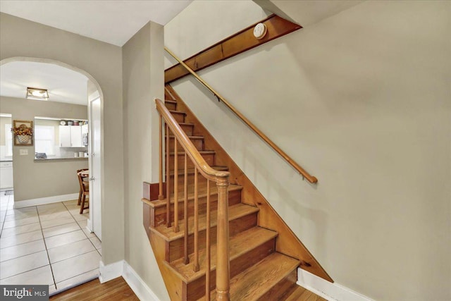 stairs with tile patterned floors