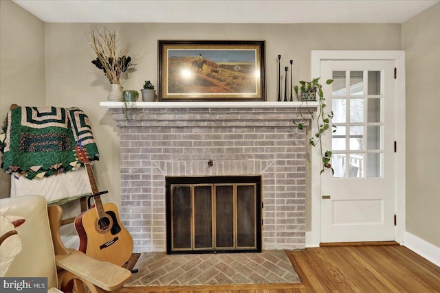 living room featuring hardwood / wood-style flooring and a fireplace