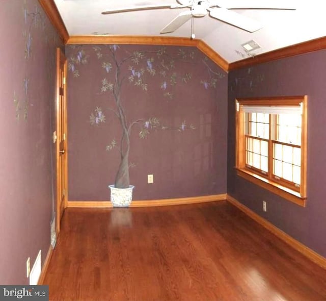 spare room with ceiling fan, lofted ceiling, and hardwood / wood-style floors