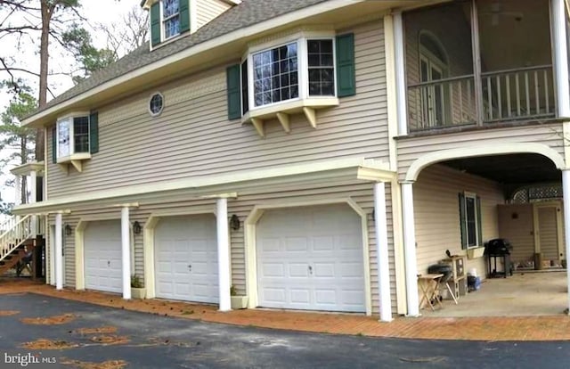 view of property exterior featuring a garage