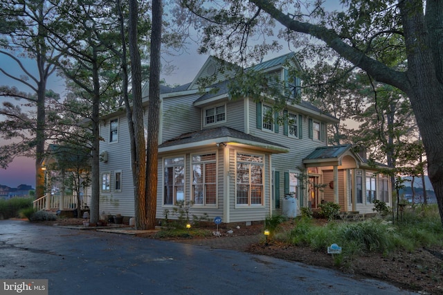 view of property exterior at dusk