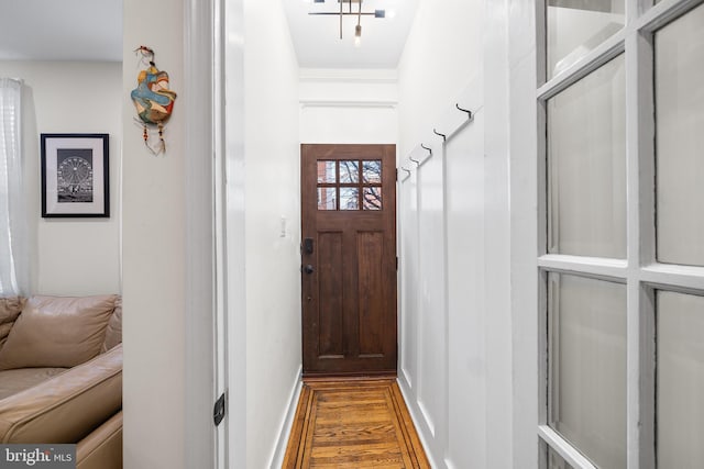 entryway with hardwood / wood-style flooring