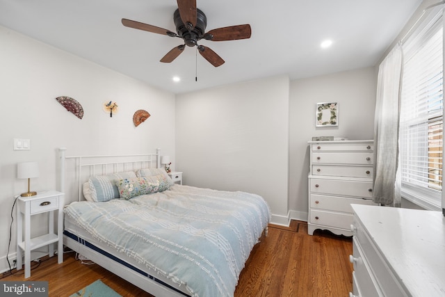 bedroom featuring ceiling fan and dark hardwood / wood-style floors