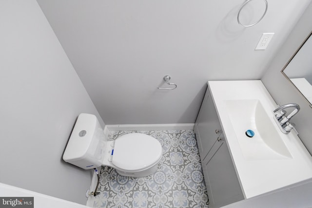 bathroom with vanity, tile patterned floors, and toilet