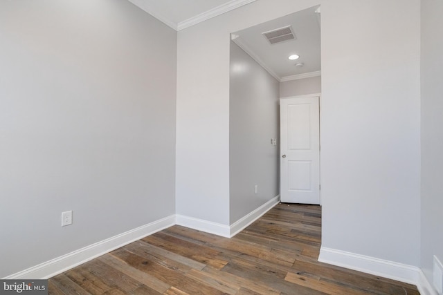 interior space featuring dark hardwood / wood-style flooring and crown molding