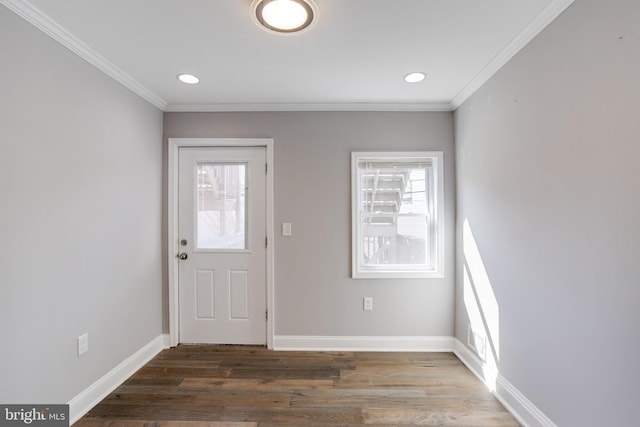 entryway featuring crown molding and hardwood / wood-style flooring