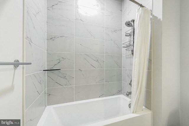 bathroom with shower / bath combination with curtain