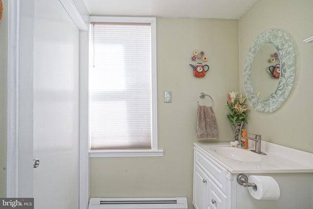 bathroom with vanity and a baseboard heating unit