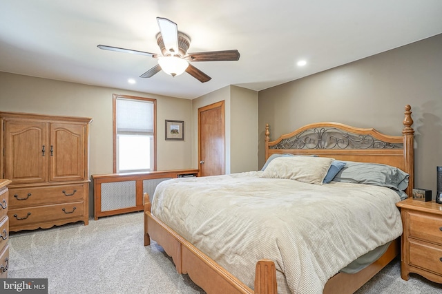 bedroom with ceiling fan, a closet, and light carpet