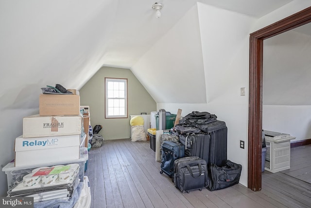 bonus room with vaulted ceiling and hardwood / wood-style floors