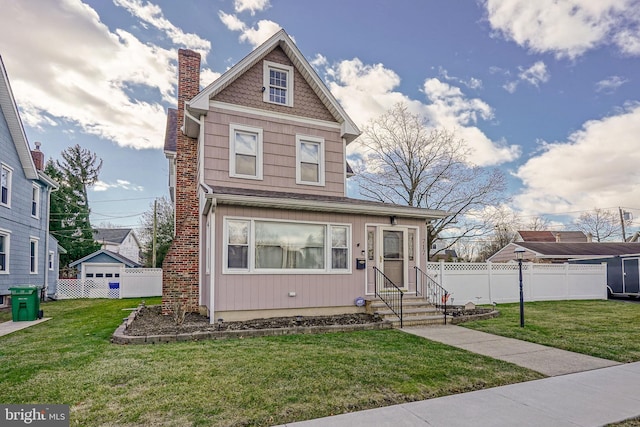 view of front of house featuring a front lawn