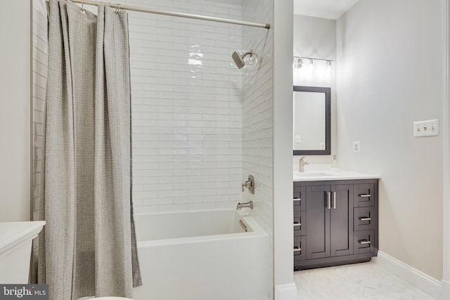 bathroom featuring shower / bath combo, vanity, and baseboards