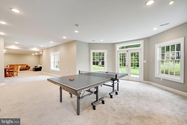 game room featuring light carpet, recessed lighting, visible vents, and french doors