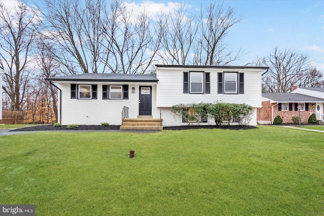 split level home with a front lawn