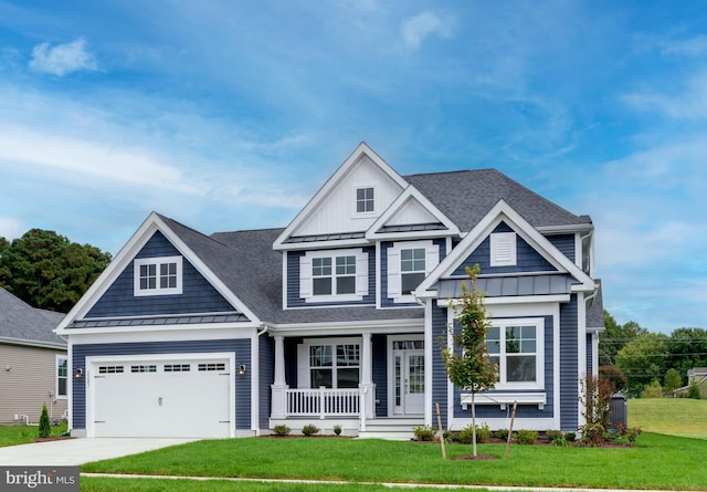 craftsman-style home with a porch, a garage, and a front lawn