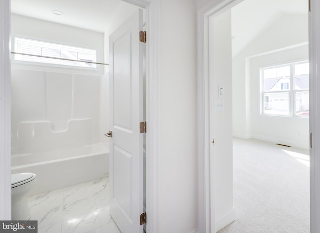 bathroom with shower / bath combination and toilet