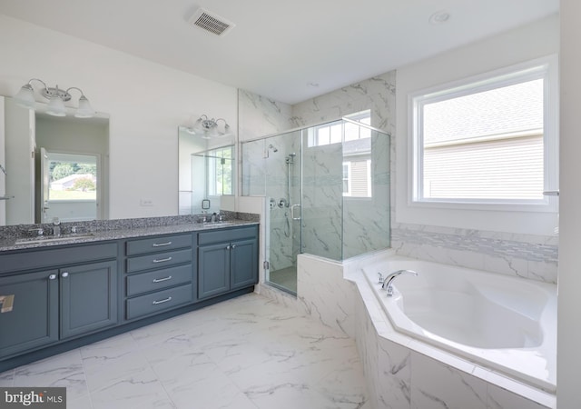 bathroom featuring independent shower and bath and vanity