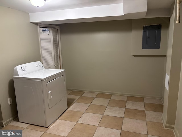 laundry area featuring light tile patterned flooring, washer / dryer, and electric panel